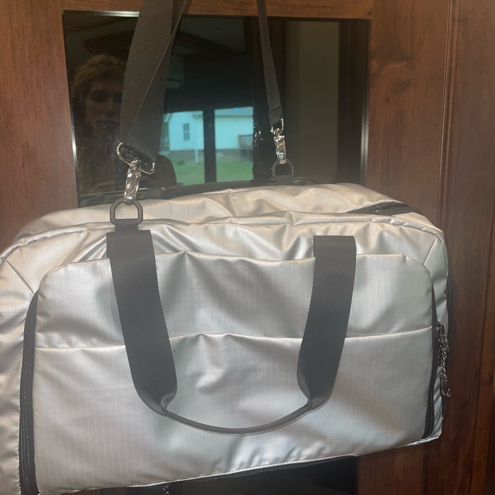 Metallic silver gym bag. Excellent condition.